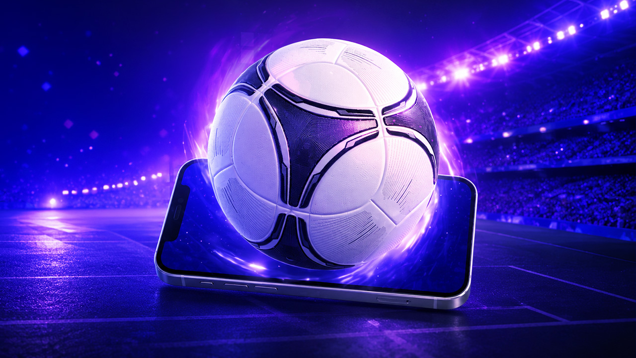 Minge de fotbal luminoasă deasupra unui telefon, pe stadion